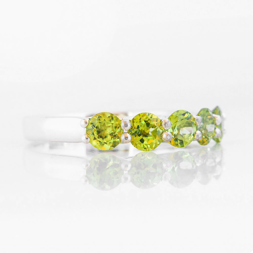 Danelle, a Peridot Half Eternity Trellis Ring