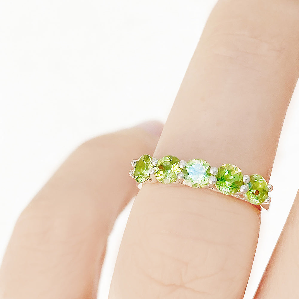 Danelle, a Peridot Half Eternity Trellis Ring