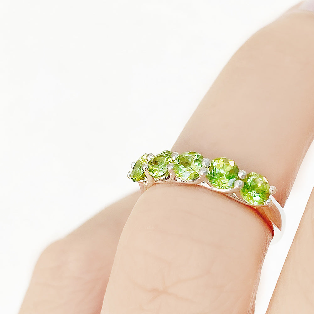 Danelle, a Peridot Half Eternity Trellis Ring