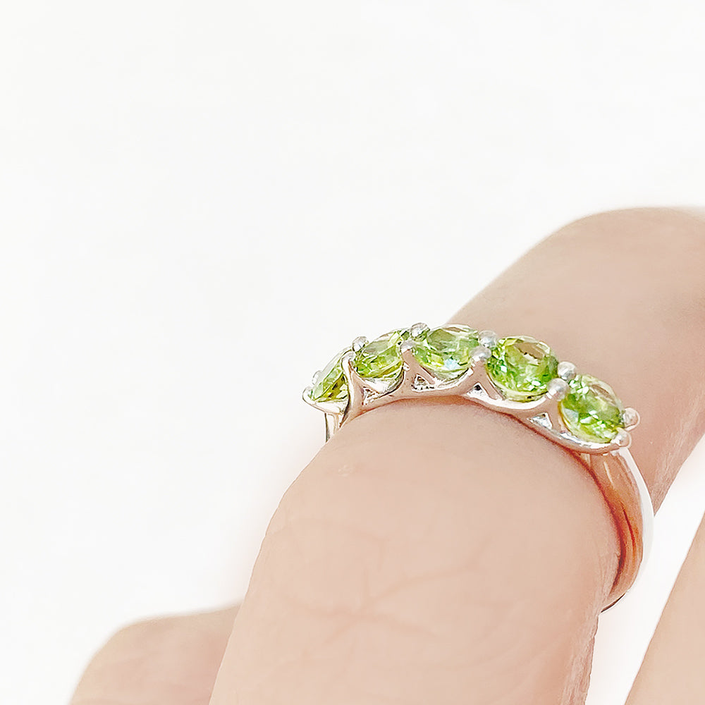 Danelle, a Peridot Half Eternity Trellis Ring