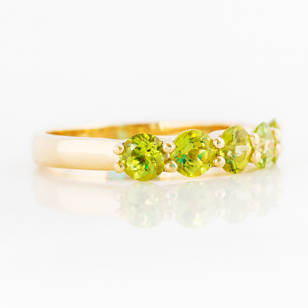 Danelle, a Peridot Half Eternity Trellis Ring