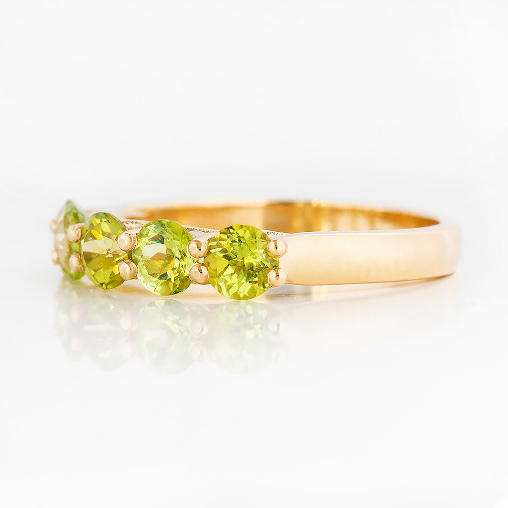 Danelle, a Peridot Half Eternity Trellis Ring