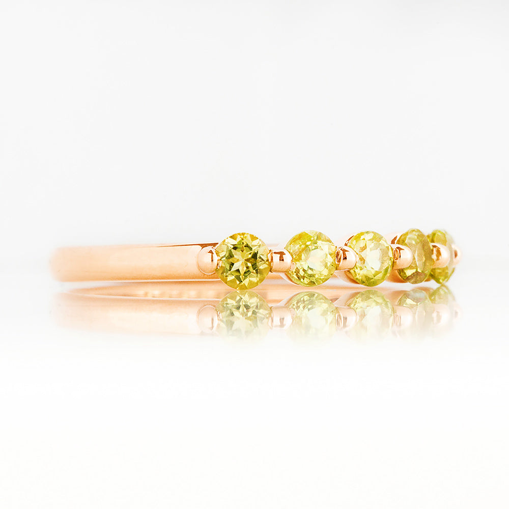 Ellie, a Peridot Six Stone Half Eternity Ring