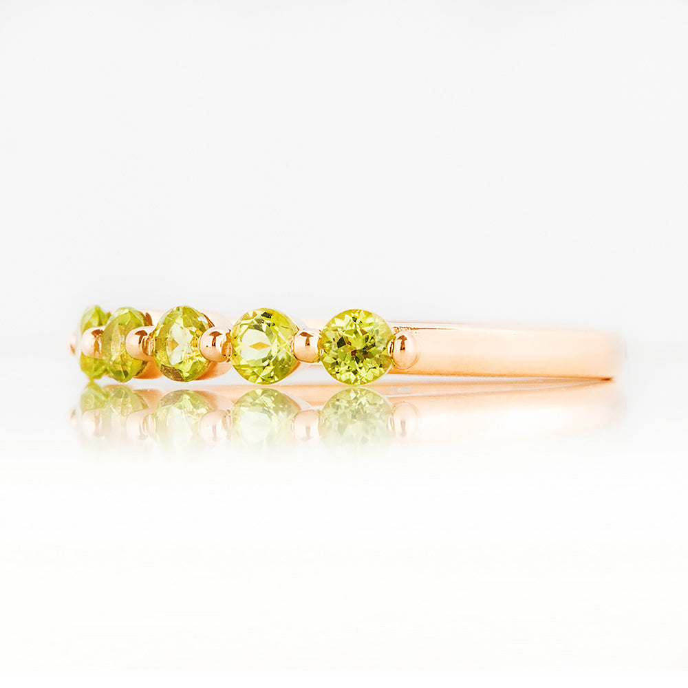 Ellie, a Peridot Six Stone Half Eternity Ring