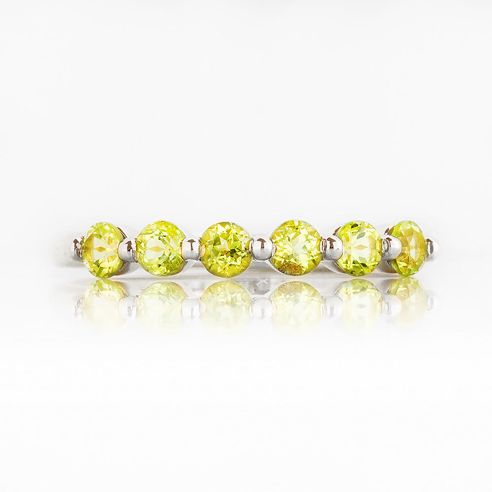 Ellie, a Peridot Six Stone Half Eternity Ring