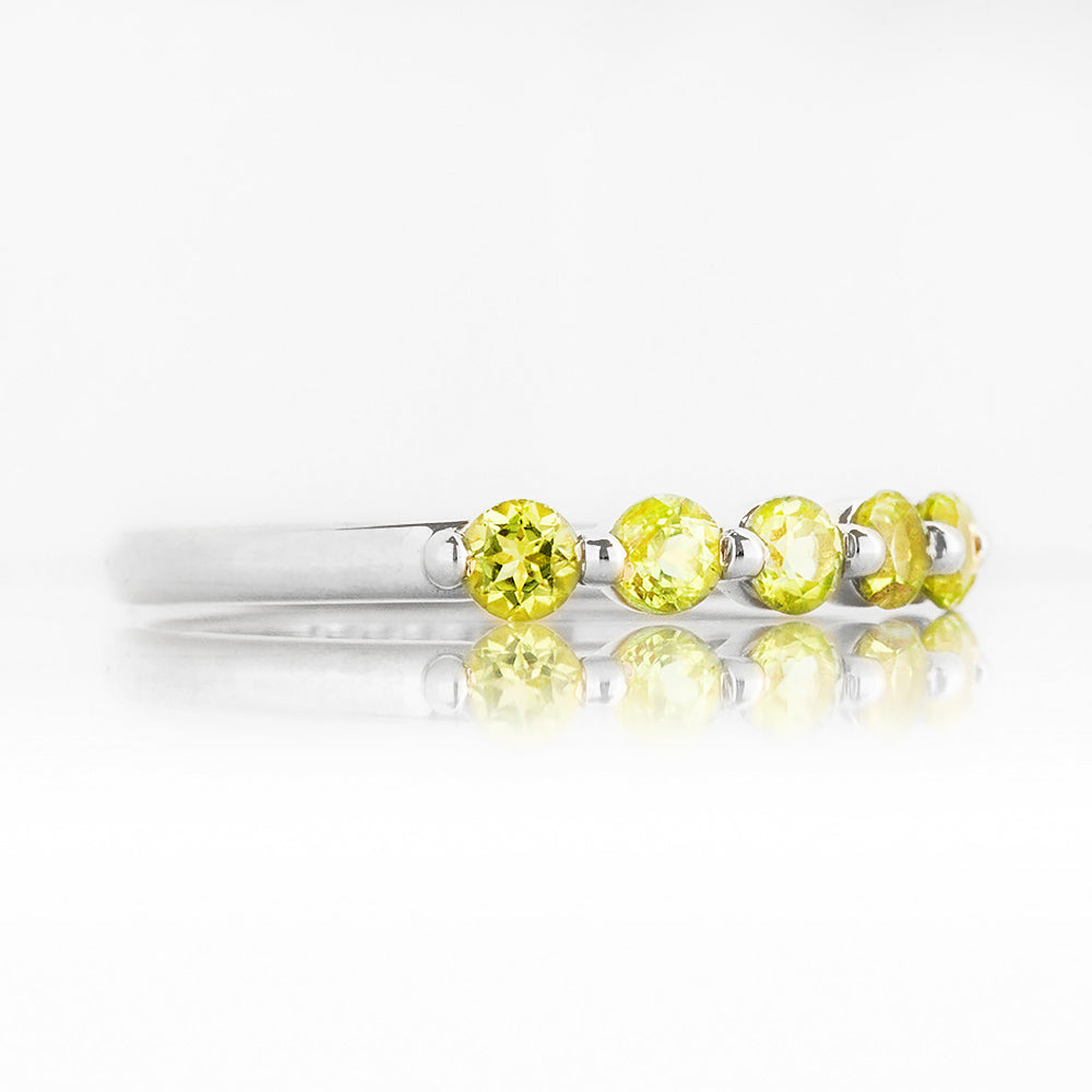 Ellie, a Peridot Six Stone Half Eternity Ring