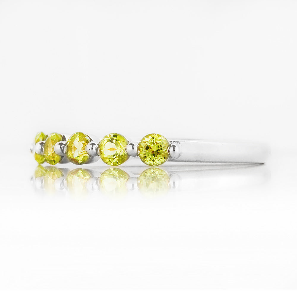 Ellie, a Peridot Six Stone Half Eternity Ring