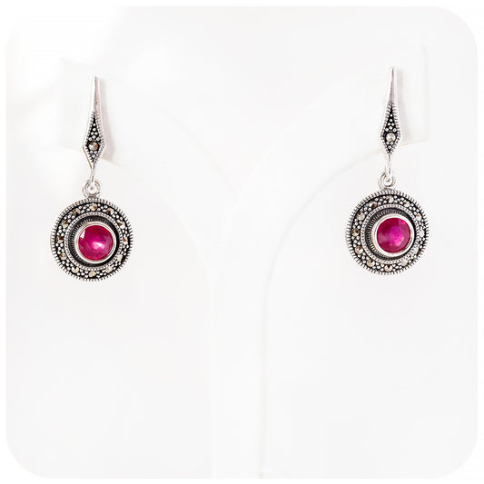 round cut ruby stud earrings in a vintage hanging disc design