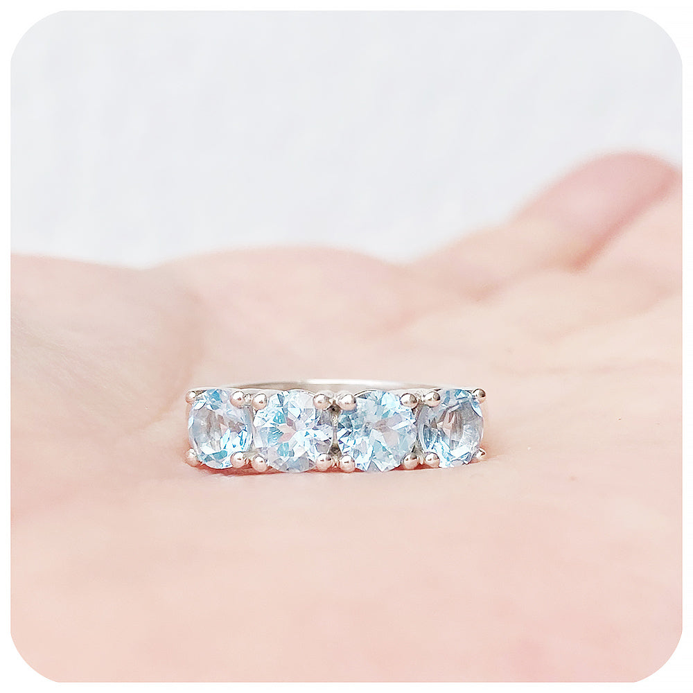 The Sky Blue Topaz Four Stone Half Eternity Ring