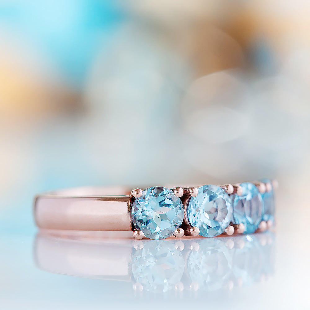 Celine, a Sky Blue Topaz Four Stone Half Eternity Ring - Victoria's Jewellery