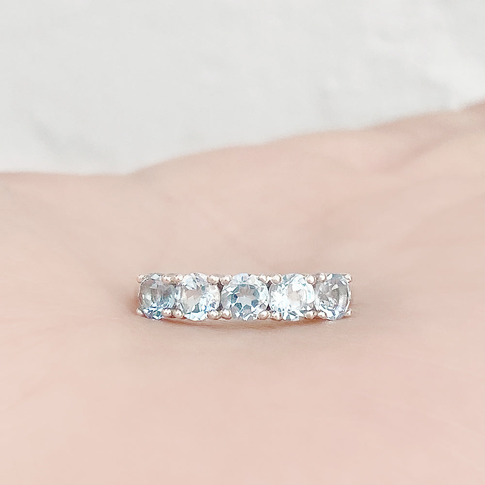 Annie, a Sky Blue Topaz Half Eternity Ring