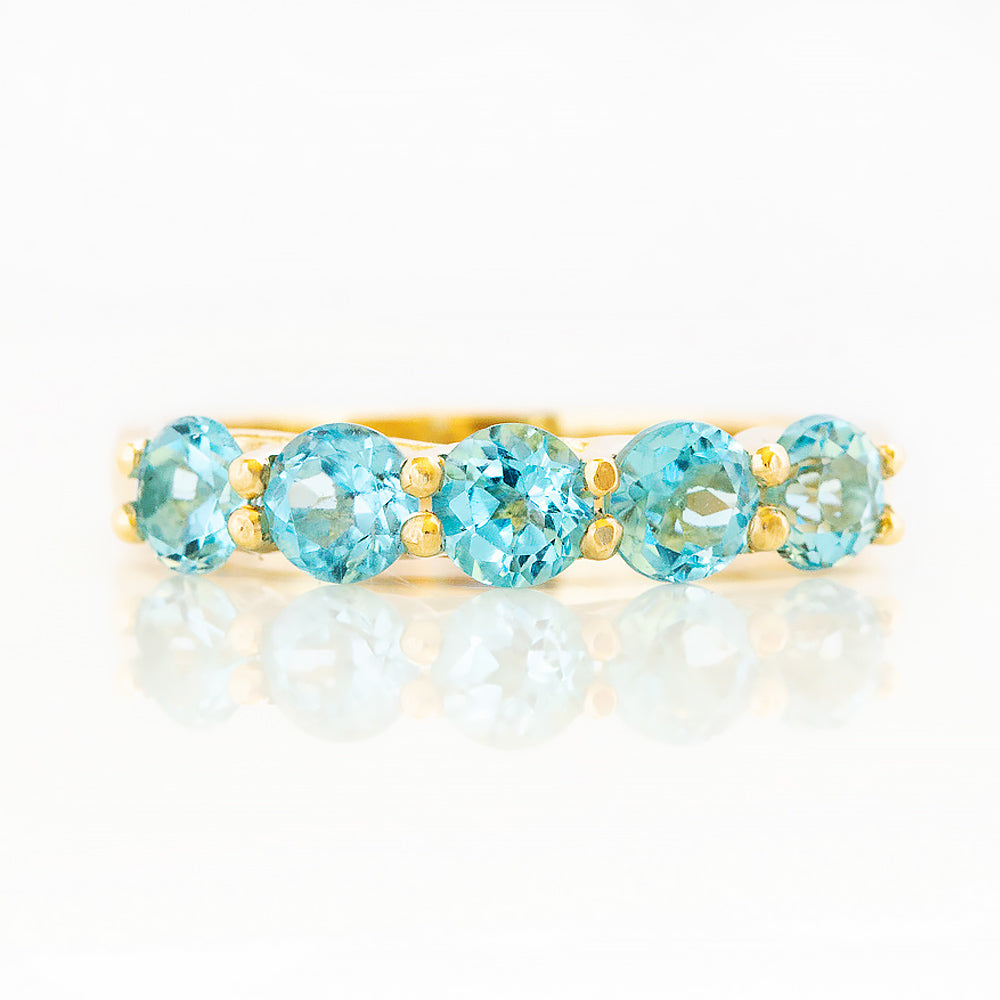 Danelle, a Swiss Blue Topaz Half Eternity Trellis Ring