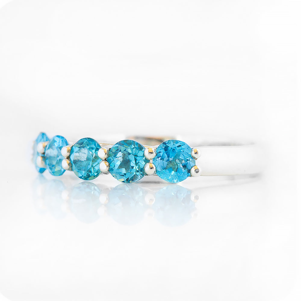 Danelle, a Swiss Blue Topaz Half Eternity Trellis Ring