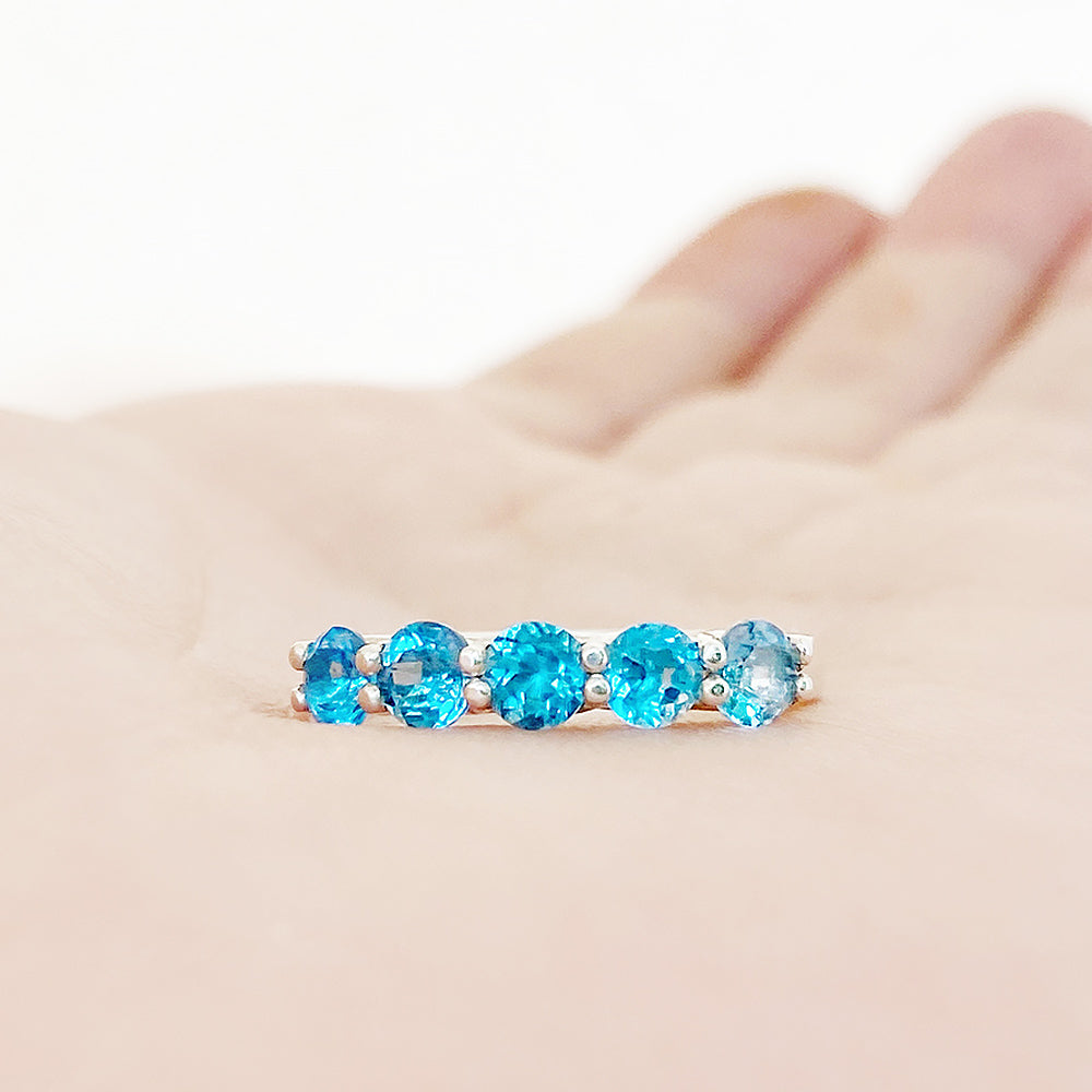 Danelle, a Swiss Blue Topaz Half Eternity Trellis Ring