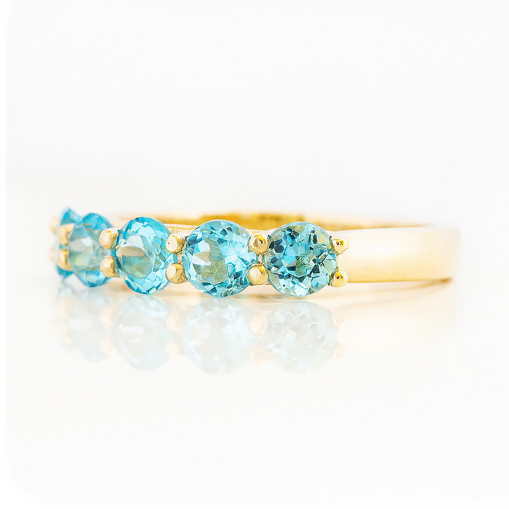 Danelle, a Swiss Blue Topaz Half Eternity Trellis Ring