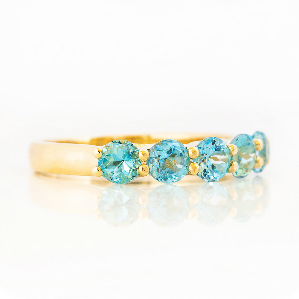 Danelle, a Swiss Blue Topaz Half Eternity Trellis Ring