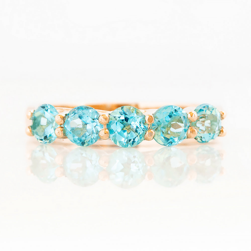 Danelle, a Swiss Blue Topaz Half Eternity Trellis Ring