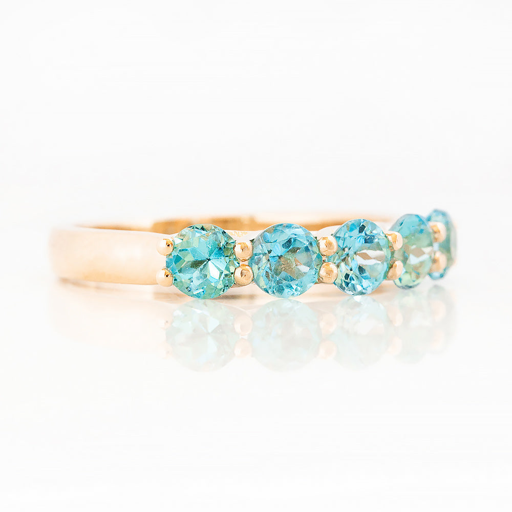 Danelle, a Swiss Blue Topaz Half Eternity Trellis Ring
