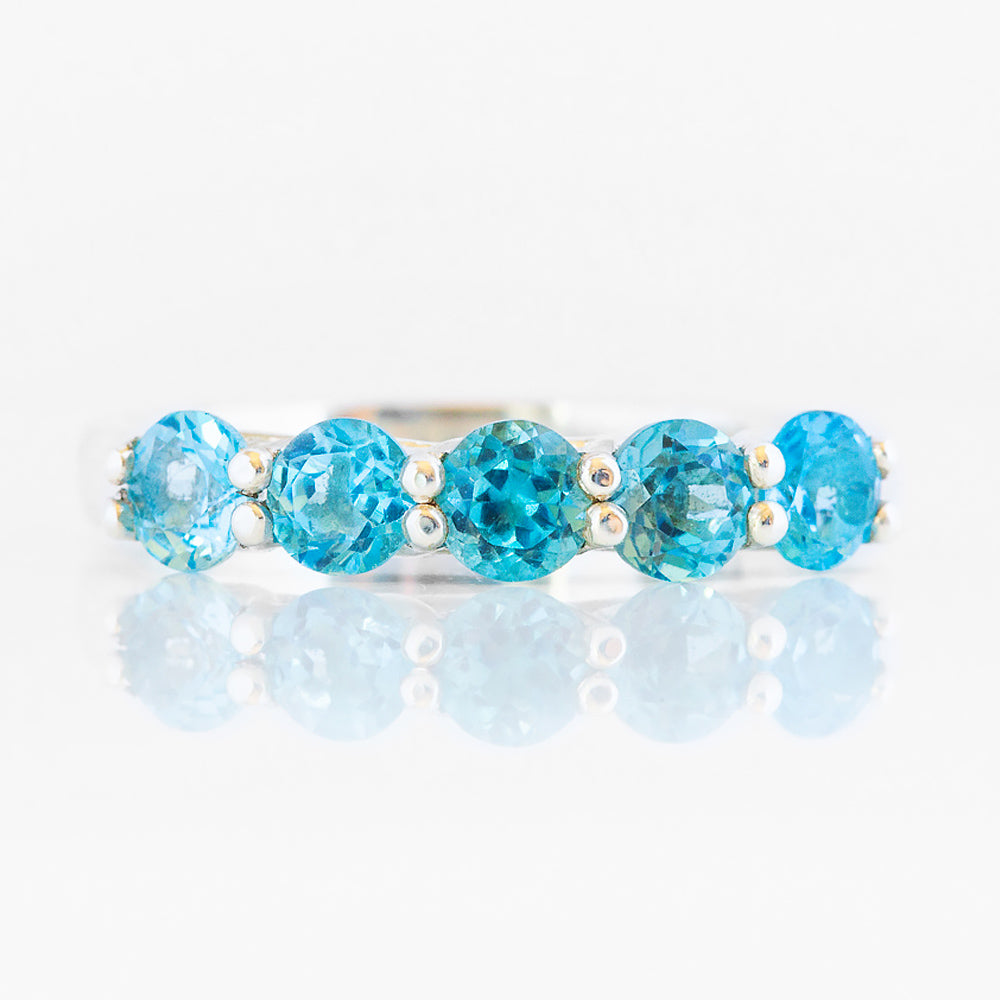 Danelle, a Swiss Blue Topaz Half Eternity Trellis Ring