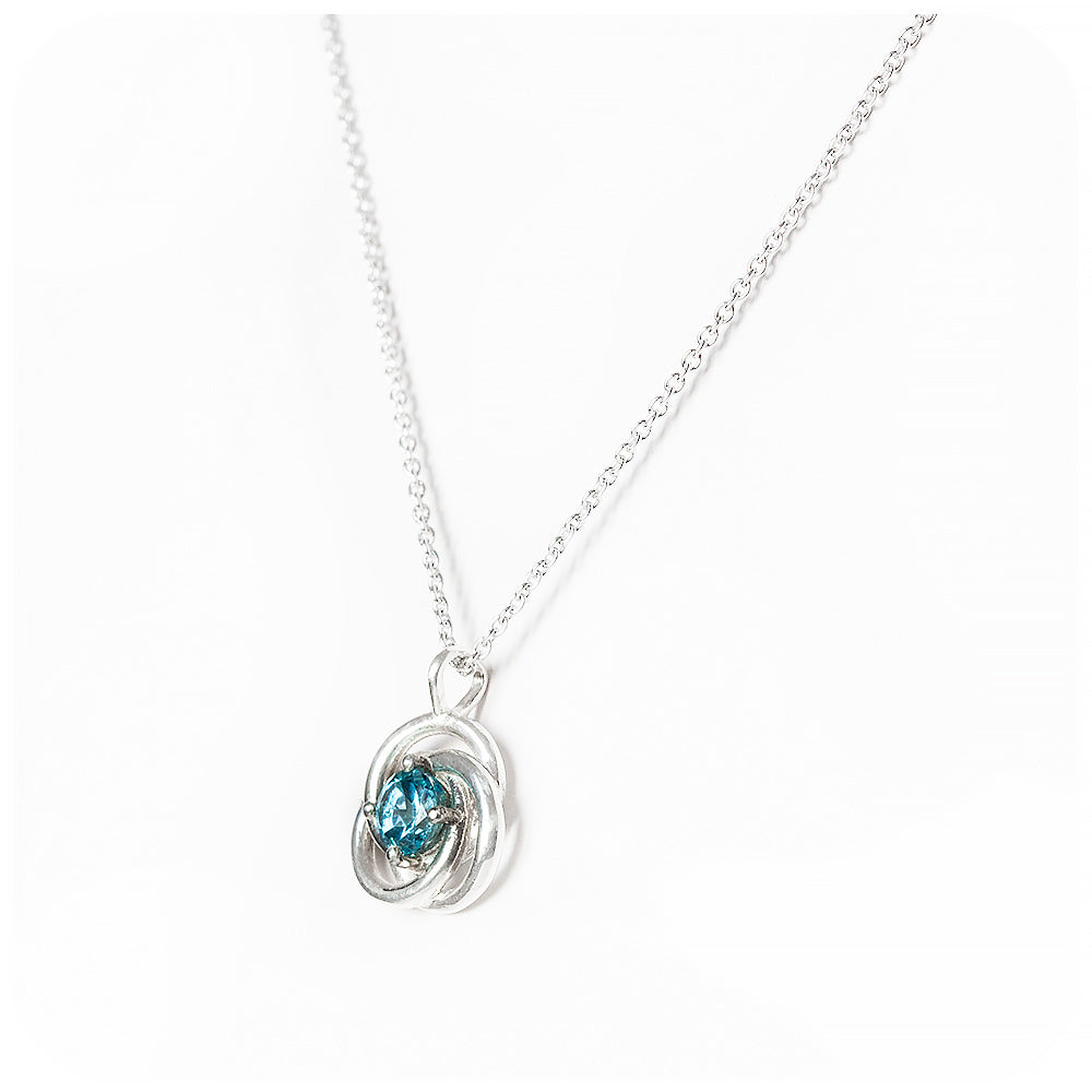 Freyja, a round cut Swiss Blue Topaz Pendant