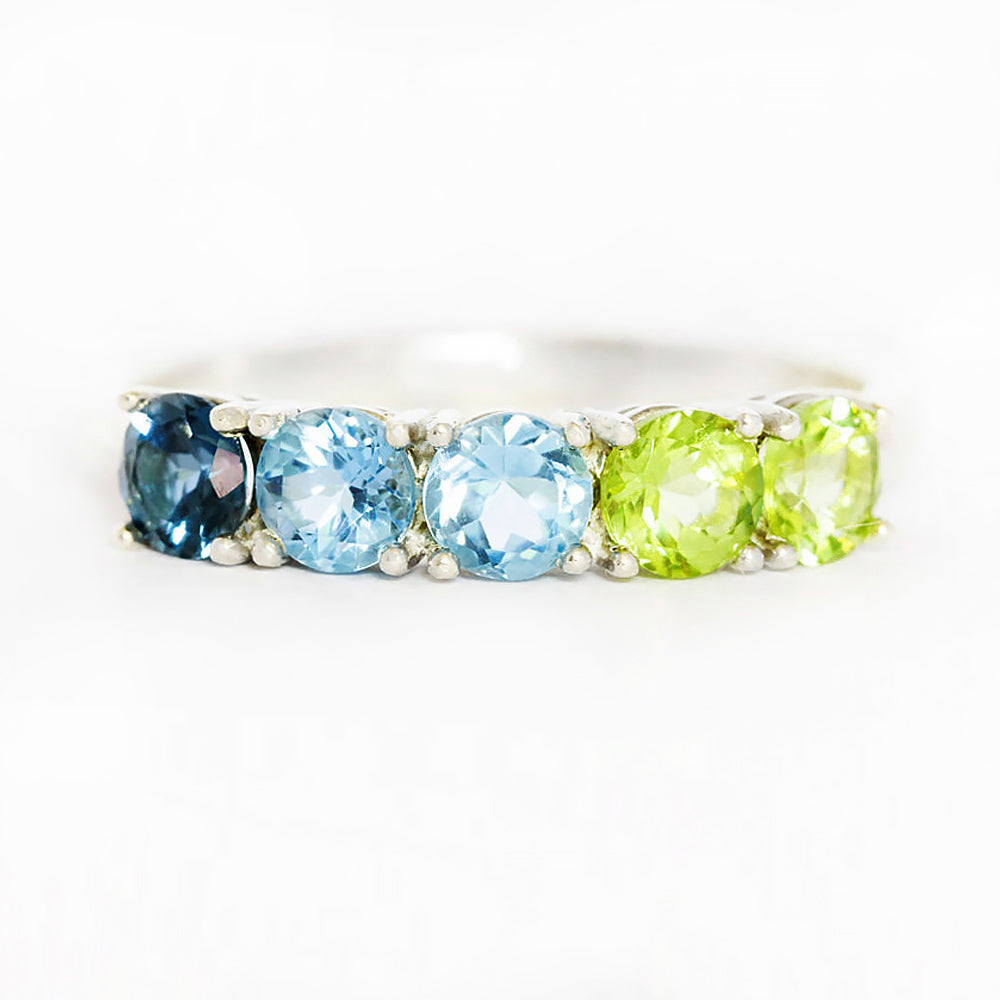 Annie, a Topaz and Peridot Half Eternity Ring