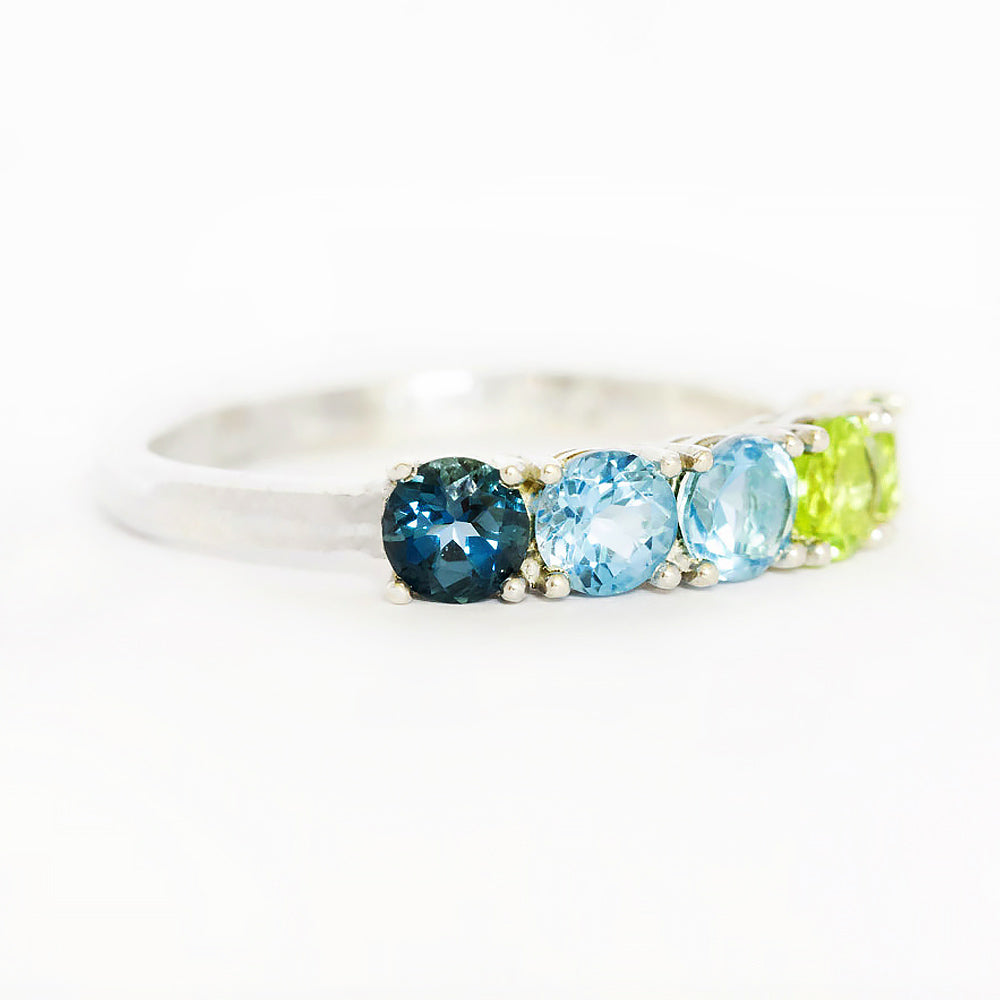 Annie, a Topaz and Peridot Half Eternity Ring