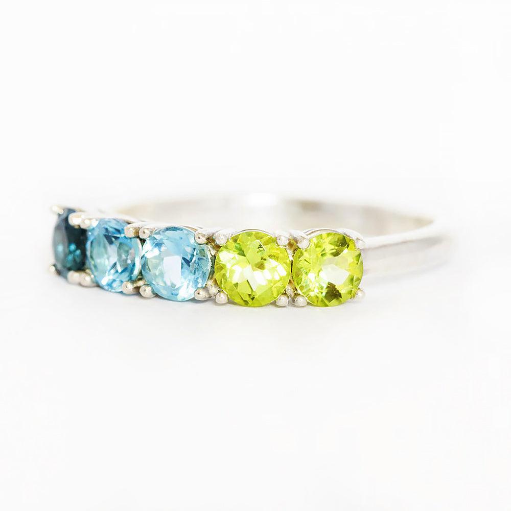 Annie, a Topaz and Peridot Half Eternity Ring