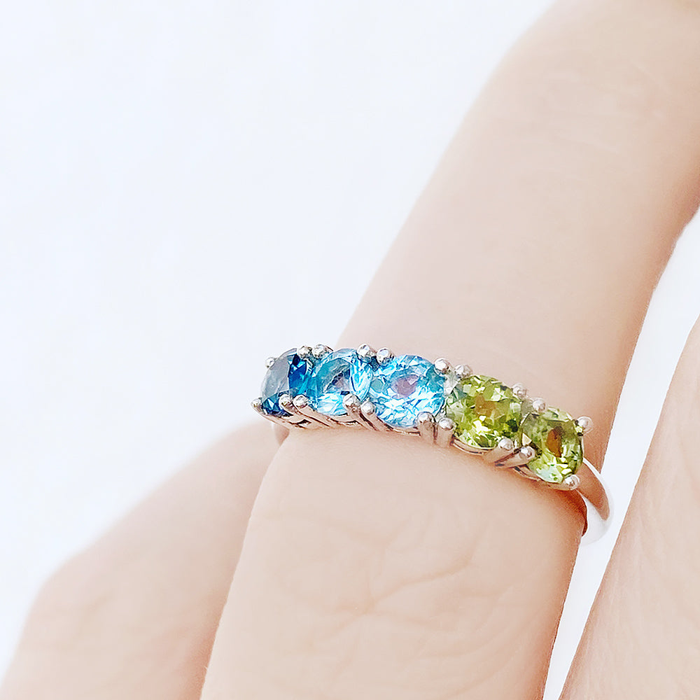 Annie, a Topaz and Peridot Half Eternity Ring