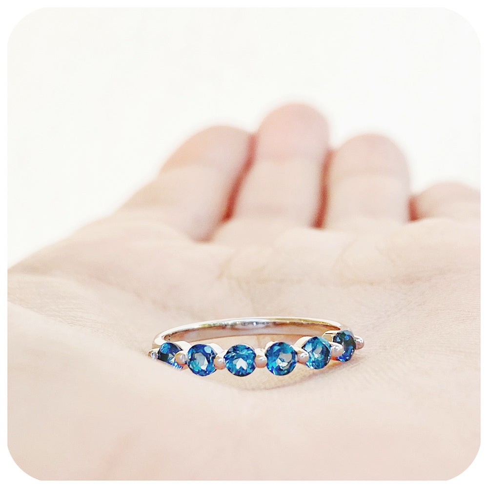 teal london blue topaz half eternity stack ring with shared claws