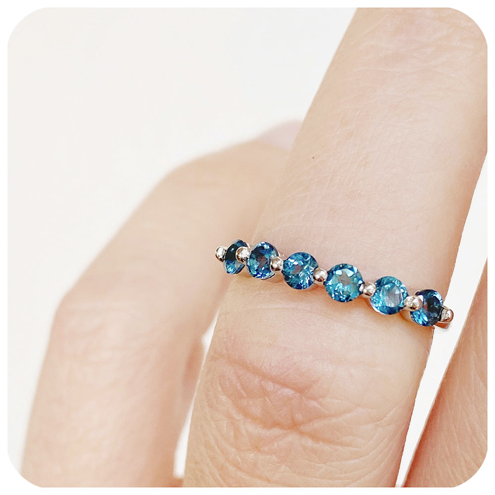 teal london blue topaz half eternity stack ring with shared claws