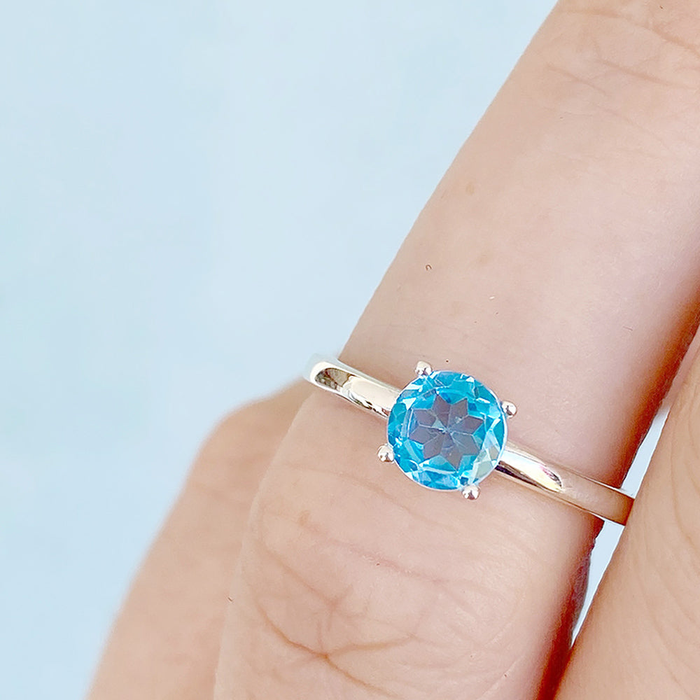 Lina, a Round cut Swiss Blue Topaz Solitaire Ring - Victoria's Jewellery