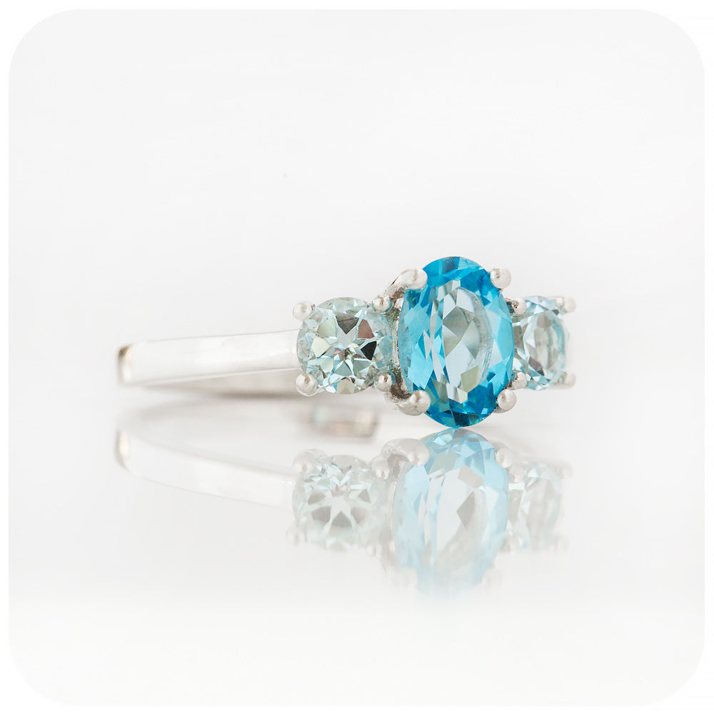 Serena, a Swiss and Sky Blue Topaz Trilogy Ring