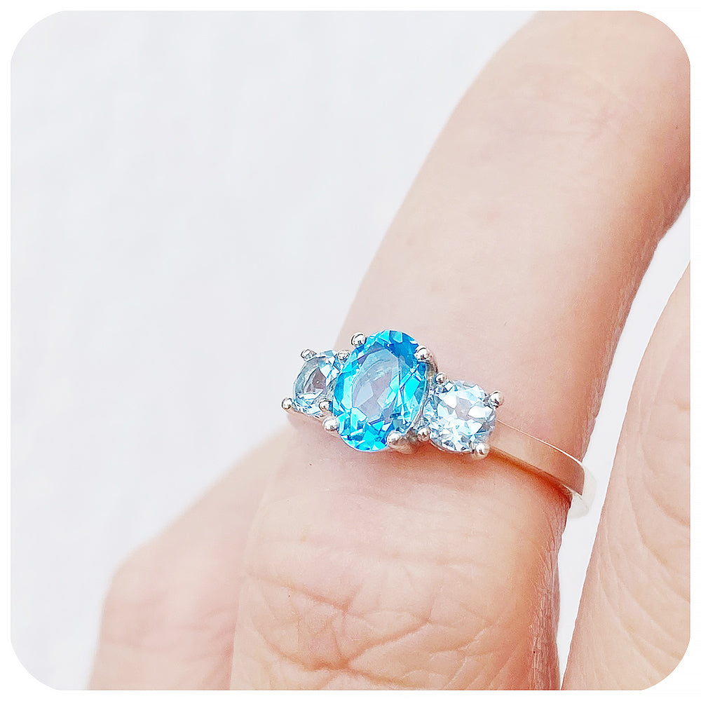 Serena, a Swiss and Sky Blue Topaz Trilogy Ring