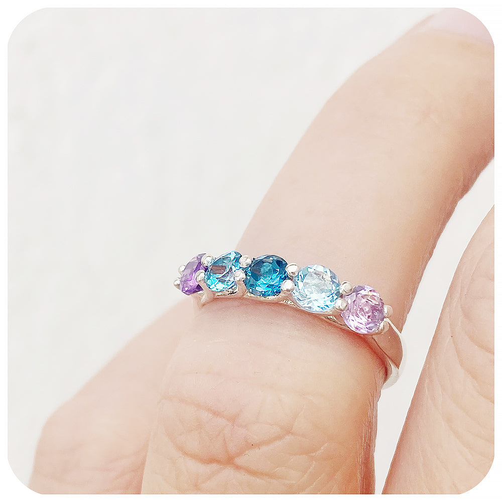 The Danelle, a Topaz and Amethyst Rainbow Half Eternity Trellis Ring