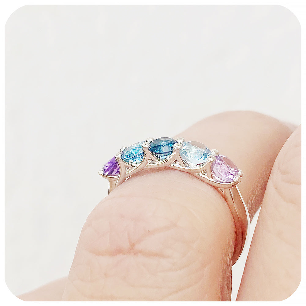 The Danelle, a Topaz and Amethyst Rainbow Half Eternity Trellis Ring