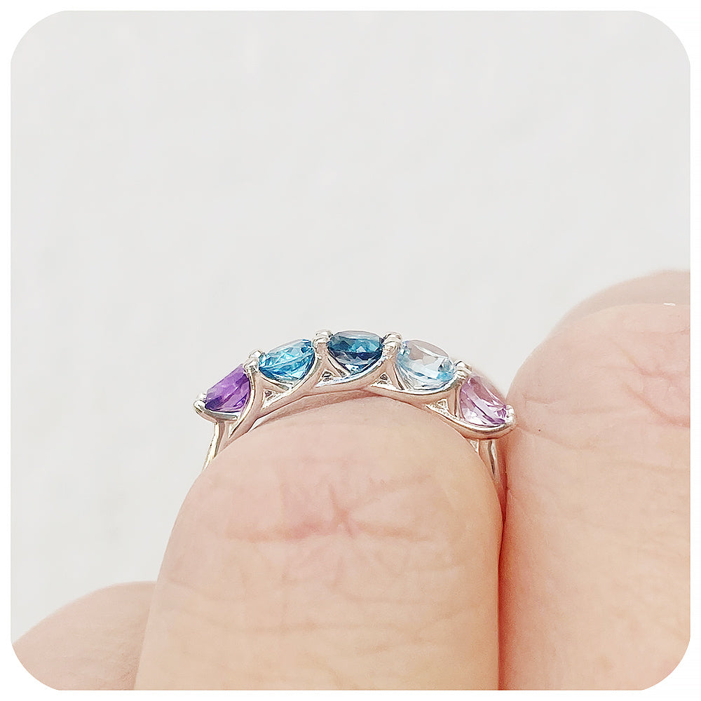 The Danelle, a Topaz and Amethyst Rainbow Half Eternity Trellis Ring