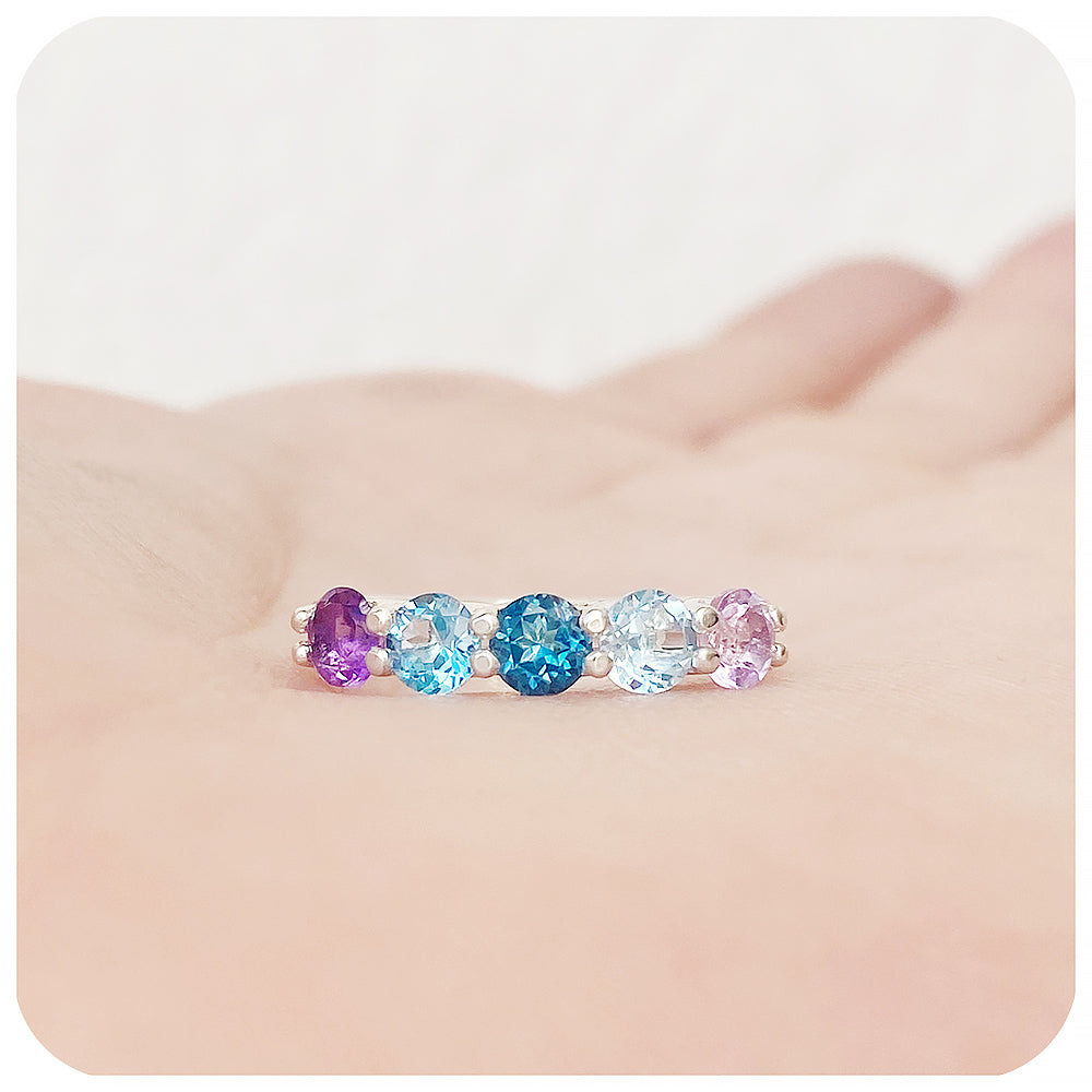 The Danelle, a Topaz and Amethyst Rainbow Half Eternity Trellis Ring