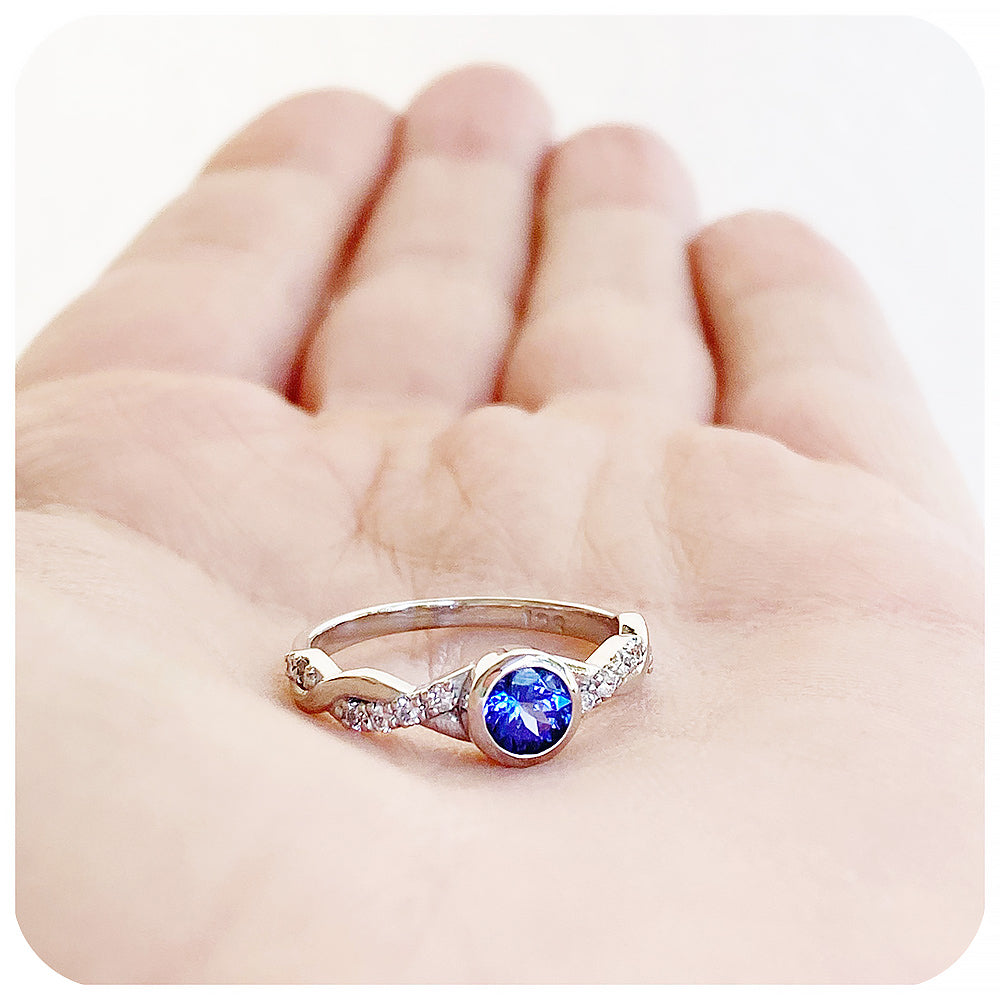 tanzanite and moissanite infinity style wedding ring