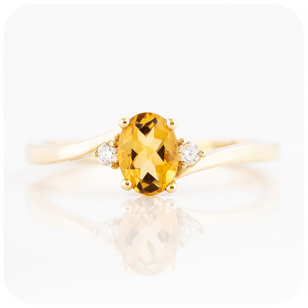 Oval cut Citrine and Moissanite Trilogy Ring with a Twist