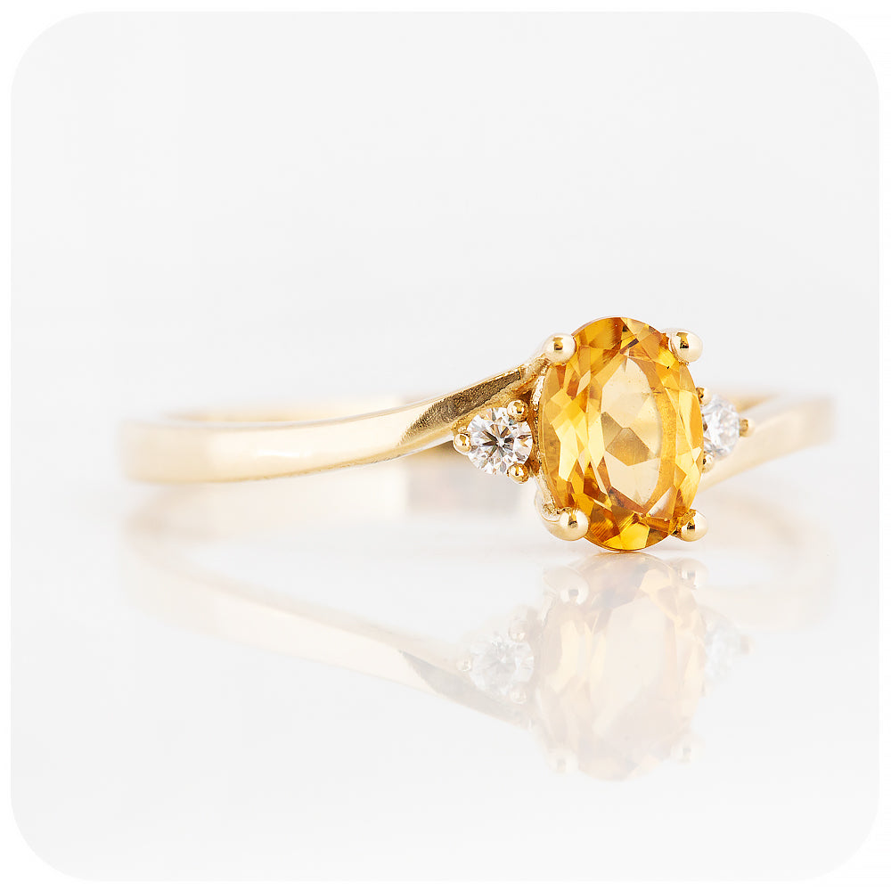 Oval cut Citrine and Moissanite Trilogy Ring with a Twist