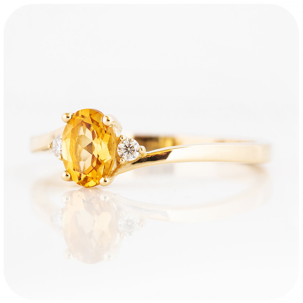 Oval cut Citrine and Moissanite Trilogy Ring with a Twist