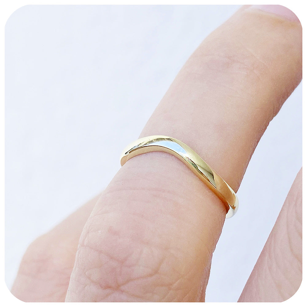Lilly, a Curved Wedding Band in Gold