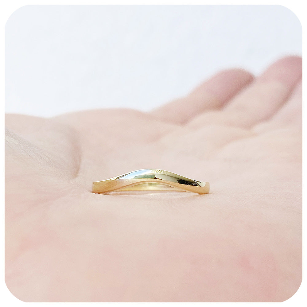 Lilly, a Curved Wedding Band in Gold