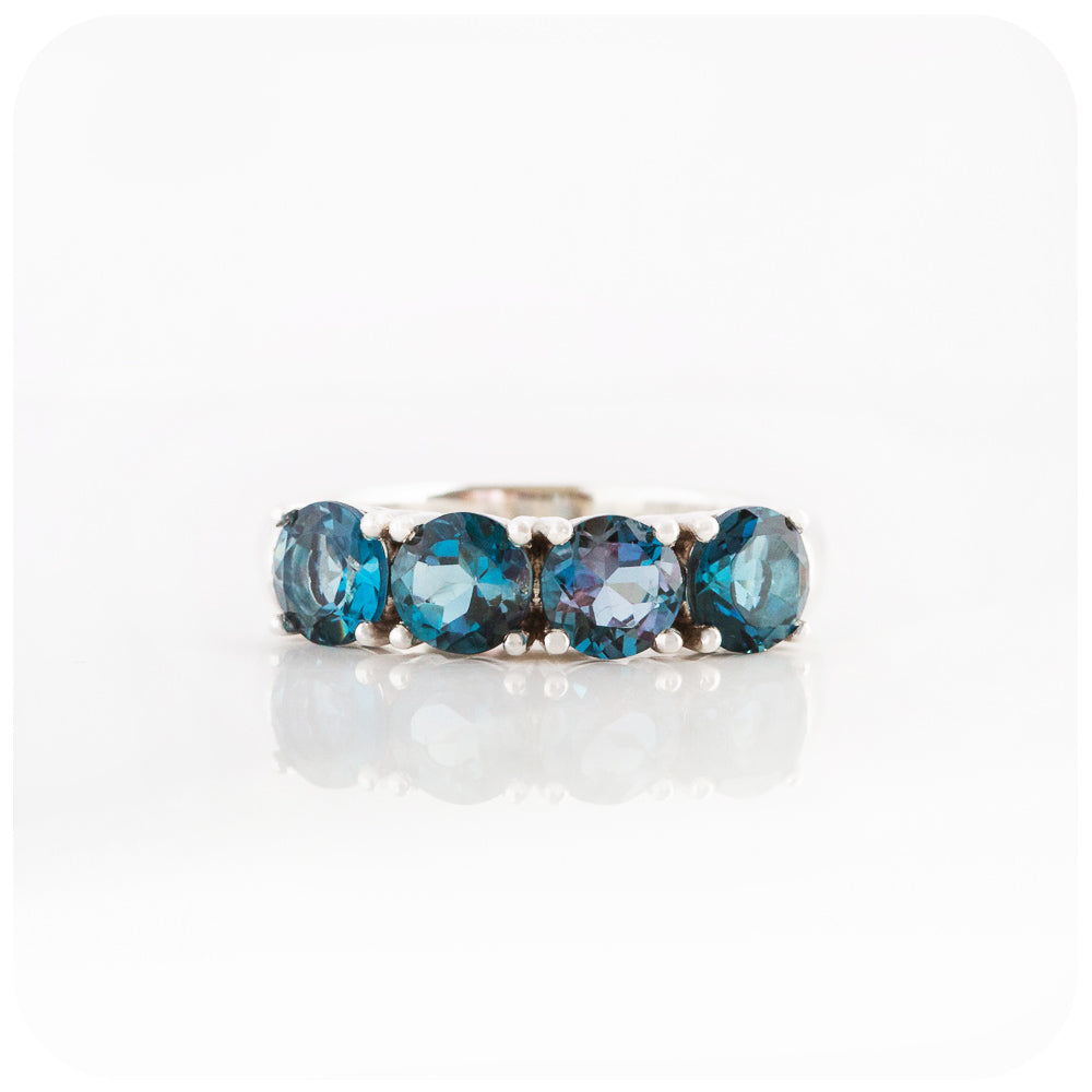 Round brilliant cut London Blue Topaz four stone Half Eternity Anniversary Ring - Victoria's Jewellery