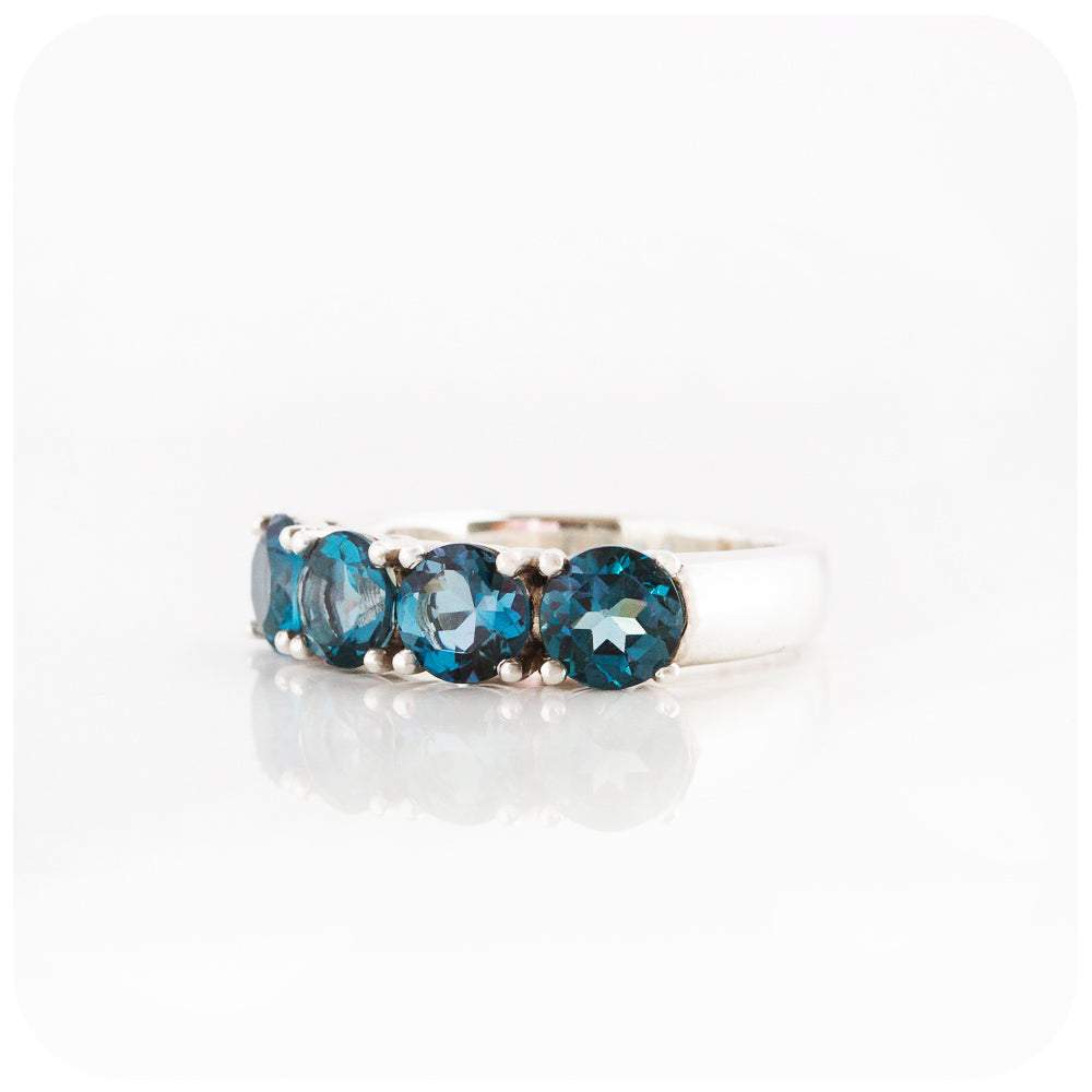 Round brilliant cut London Blue Topaz four stone Half Eternity Anniversary Ring - Victoria's Jewellery