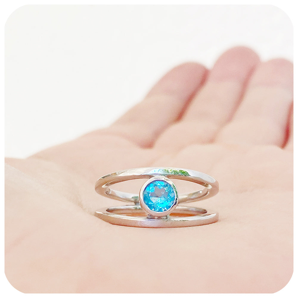 Round cut Swiss Blue Topaz Ring with a Split Band Design in Sterling Silver