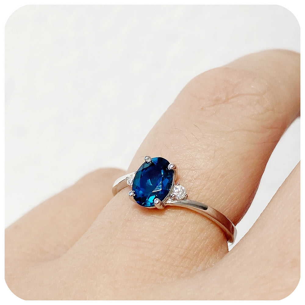 Oval cut Teal London Blue Topaz November Birthstone and Moissanite Trilogy Engagement Ring - Victoria's Jewellery