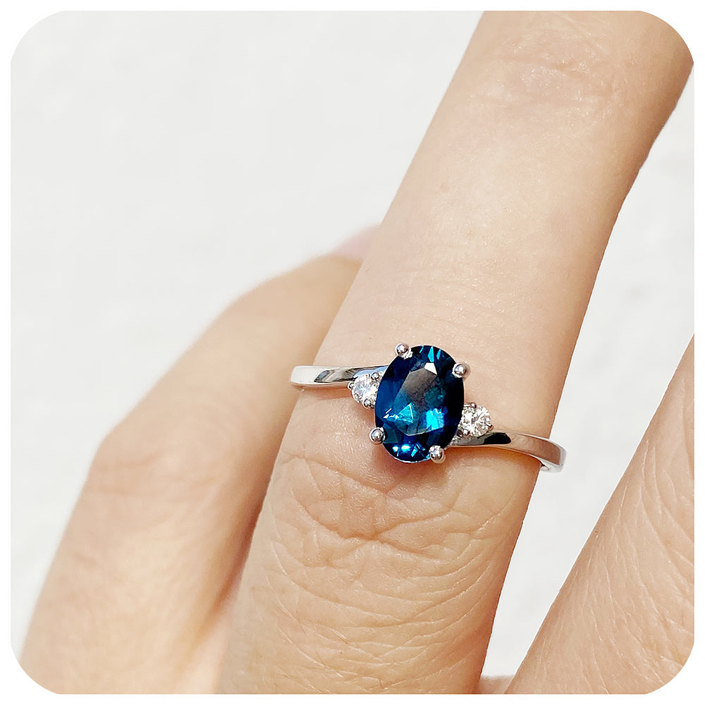 Oval cut Teal London Blue Topaz November Birthstone and Moissanite Trilogy Engagement Ring - Victoria's Jewellery