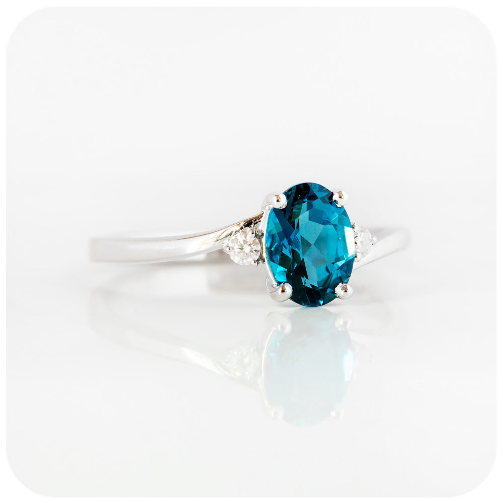 Oval cut Teal London Blue Topaz November Birthstone and Moissanite Trilogy Engagement Ring - Victoria's Jewellery