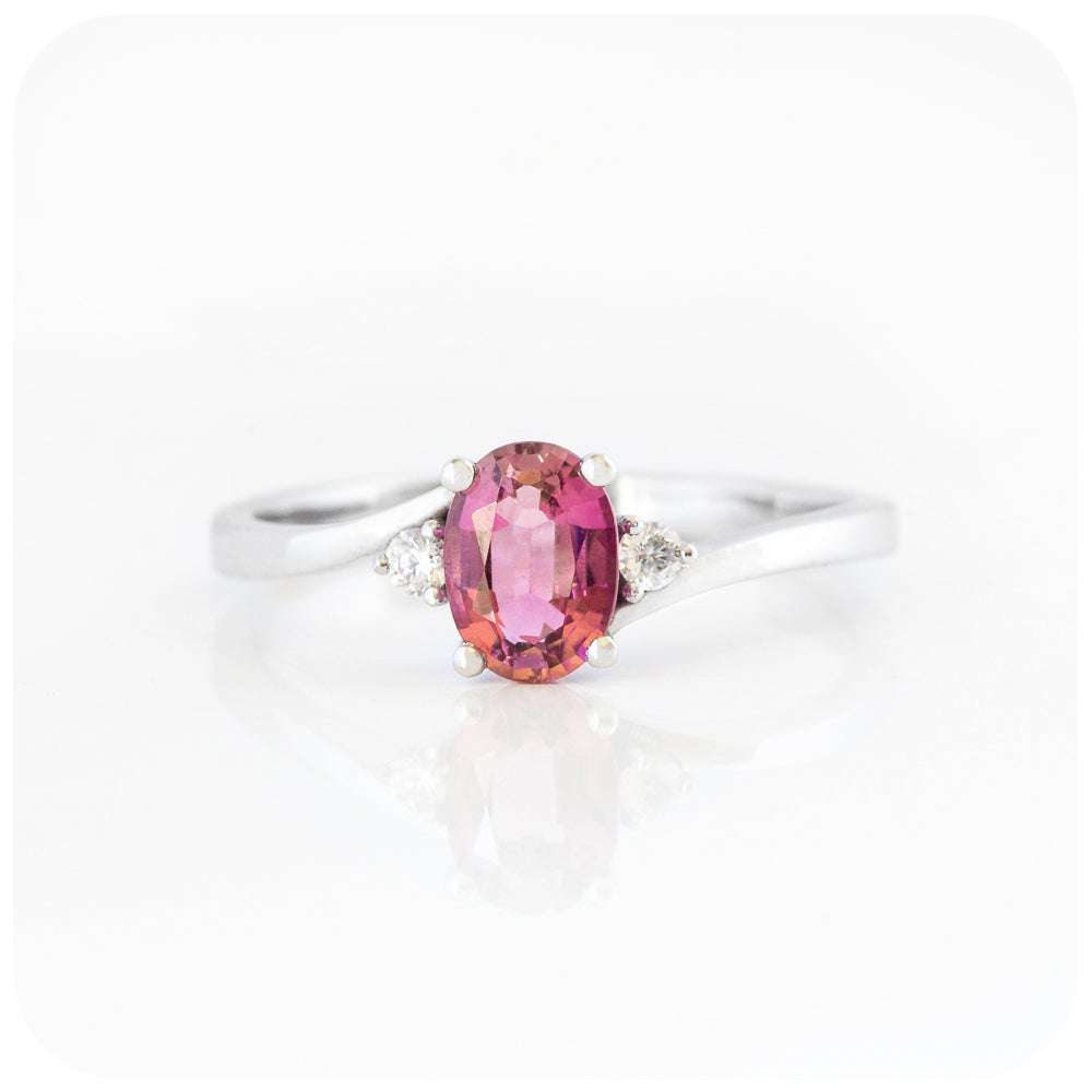 Oval cut Pink Tourmaline and Moissanite Trilogy Ring with a Twist